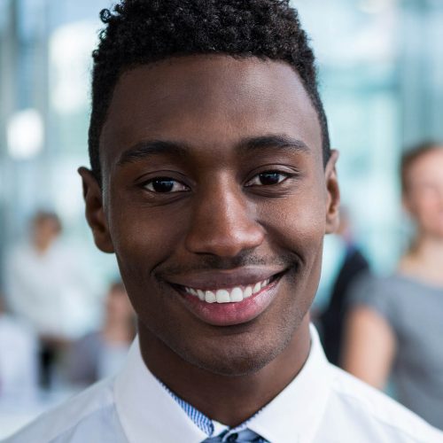 Portrait of smiling businessman in office