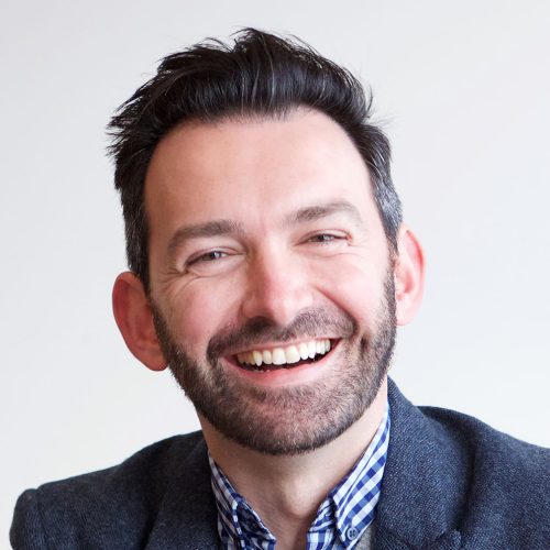 smiling businessman sitting in office