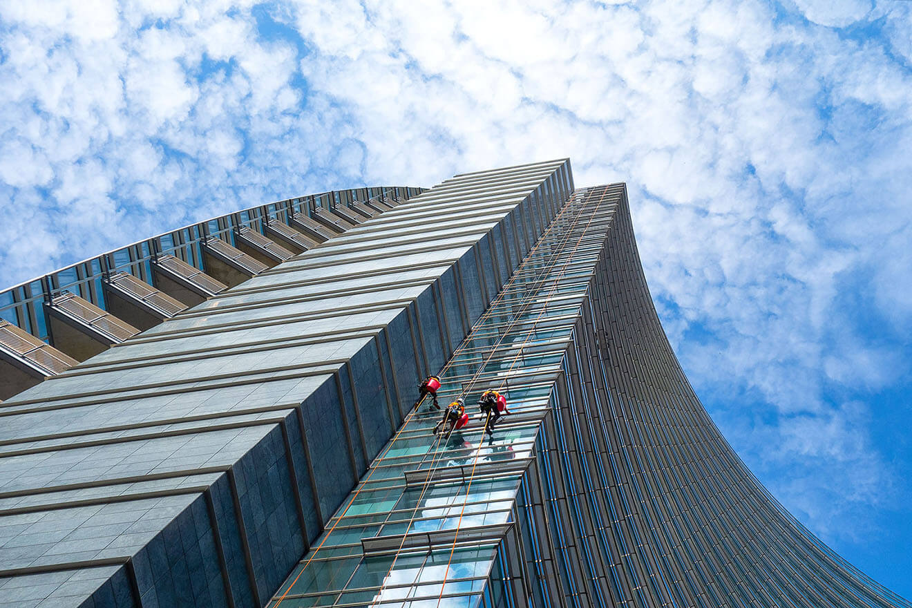group-of-alpinists-in-service-for-windows-cleaning-2021-08-26-18-34-32-utc-1