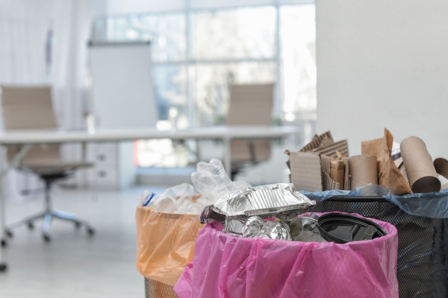 full-trash-cans-in-modern-office-space-for-text-2026-03-05-19-47-53-utc