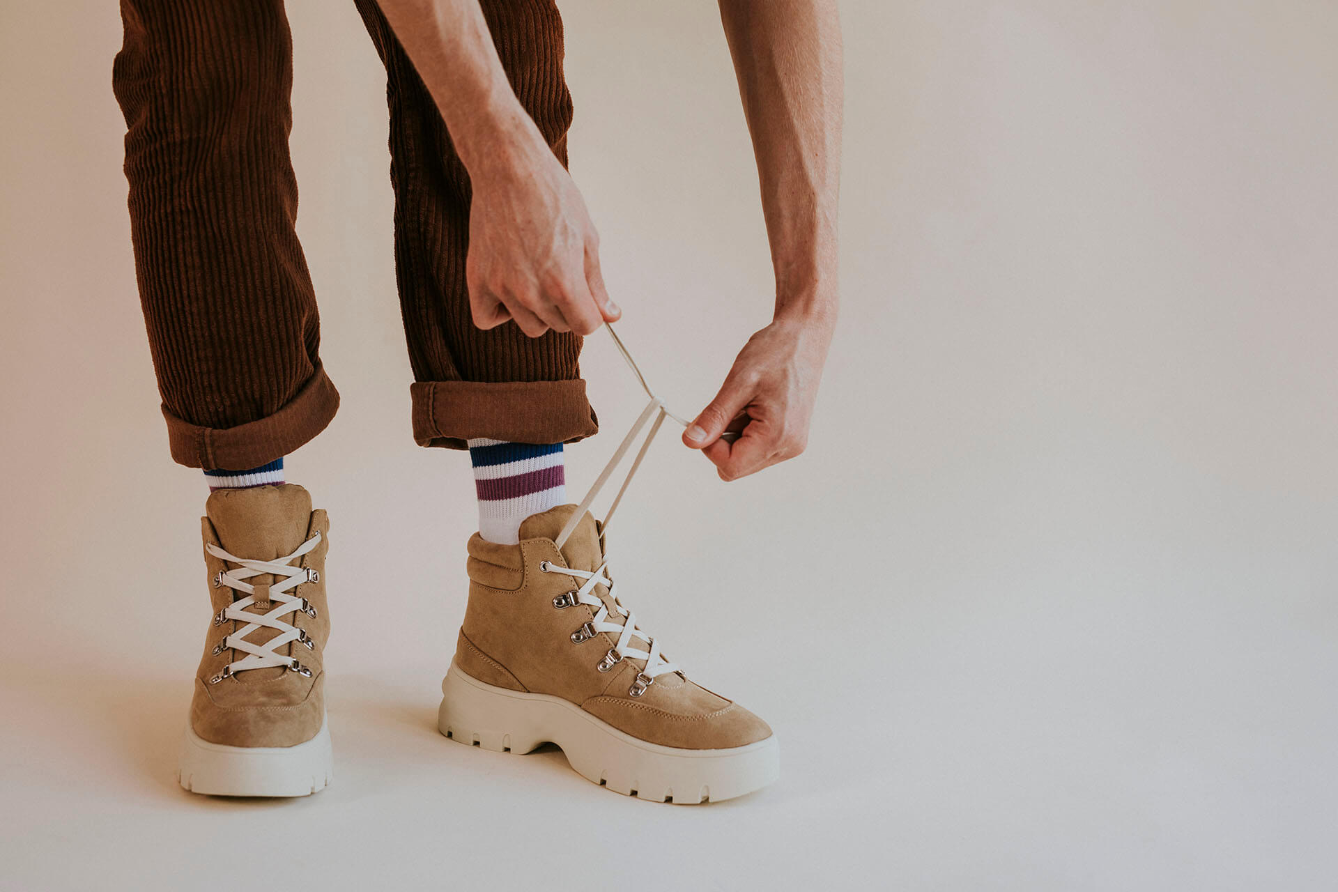 model-tying-laces-suede-hiking-boot-2021-08-31-04-28-07-utc